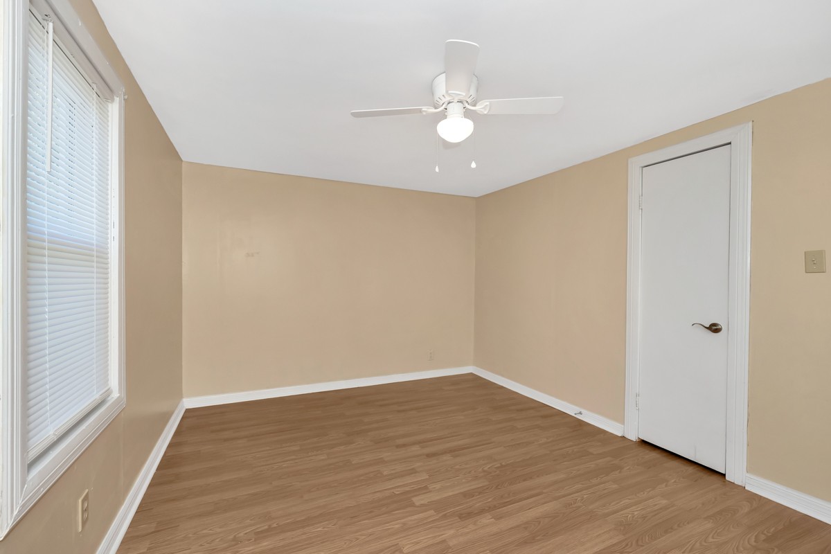 16871 New Cut Road Athens, AL 35614 - Photo 24 of 40 a view of an empty room with wooden floor and a window