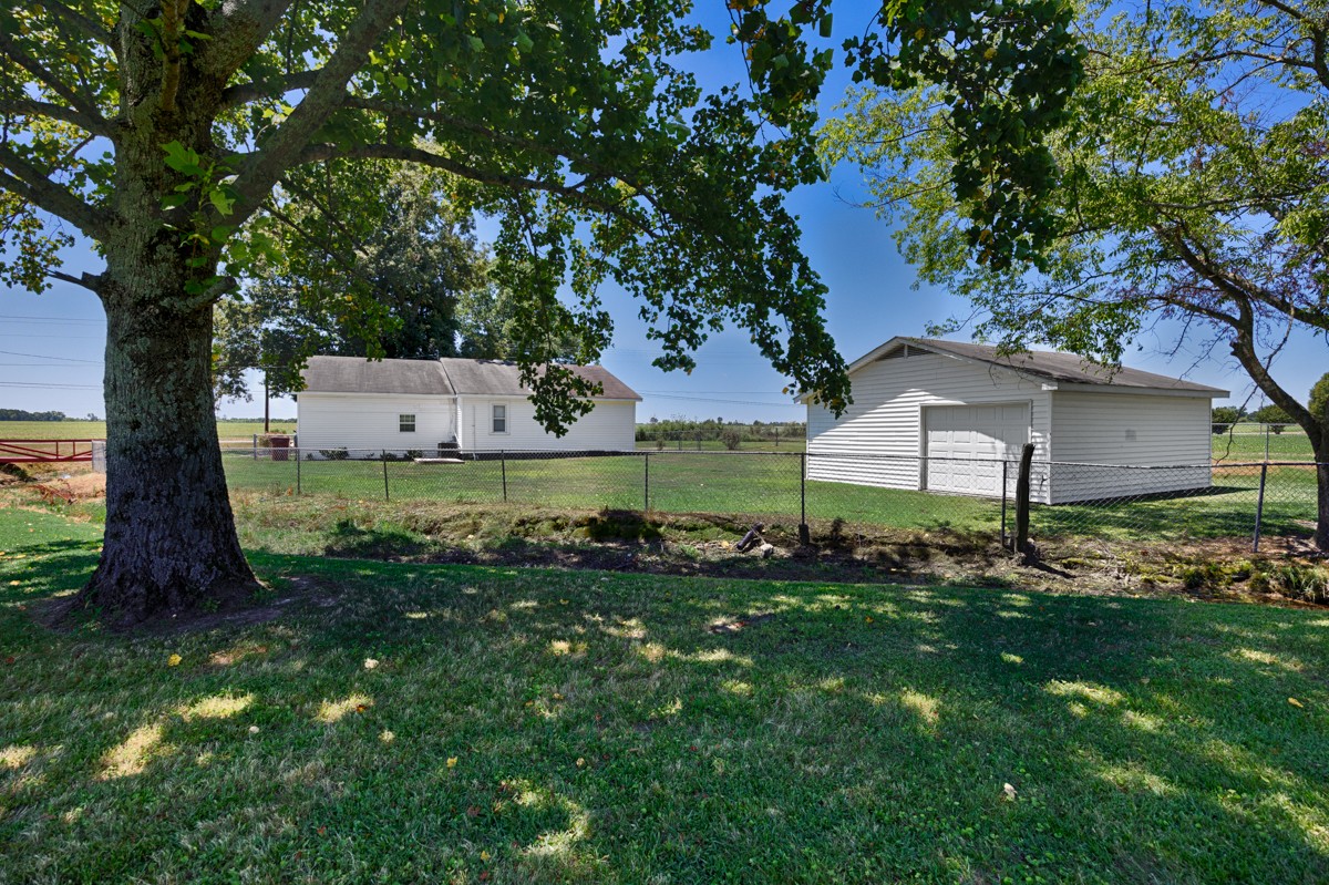 16871 New Cut Road Athens, AL 35614 - Photo 34 of 40 a backyard of a house with lots of green space