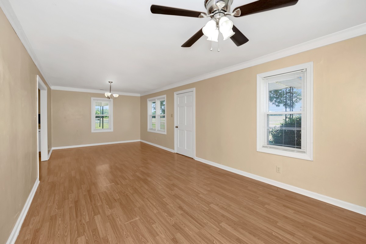 16871 New Cut Road Athens, AL 35614 - Photo 4 of 40 wooden floor in an empty room with a window