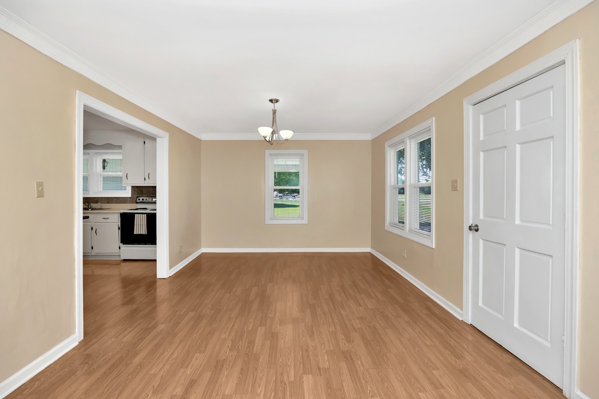 16871 New Cut Road Athens, AL 35614 - Photo 9 of 40 wooden floor in an empty room with a window
