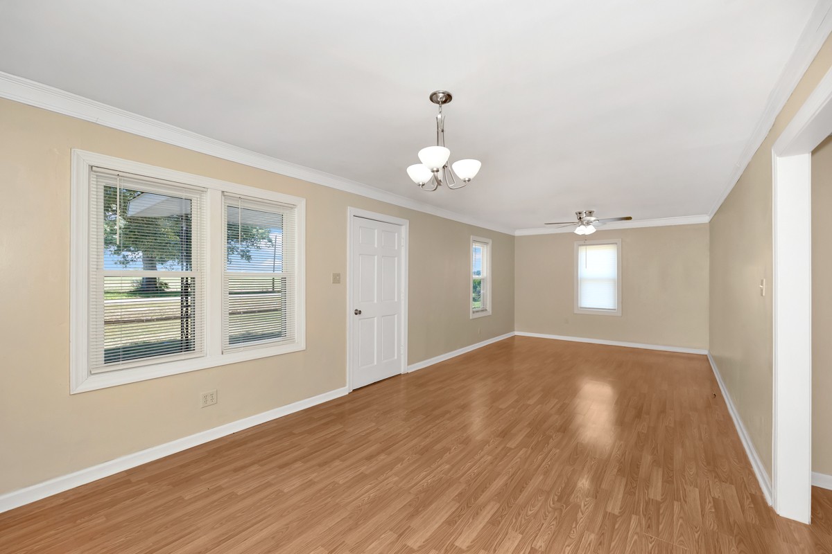16871 New Cut Road Athens, AL 35614 - Photo 10 of 40 a view of an empty room with wooden floor and a window