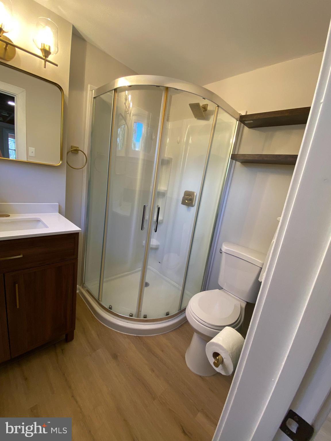 10141 Liberty Road, Unit 1 Randallstown, MD 21133 - Photo 11 of 21 a bathroom with a sink a toilet and shower