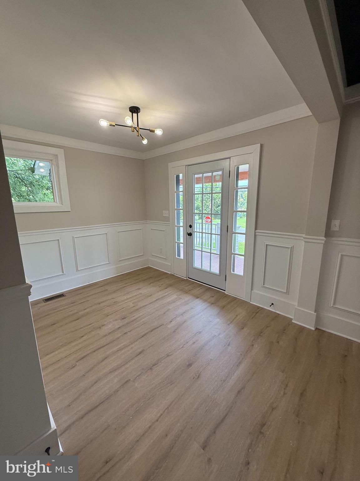 10141 Liberty Road, Unit 1 Randallstown, MD 21133 - Photo 19 of 21 wooden floor in an empty room with a window