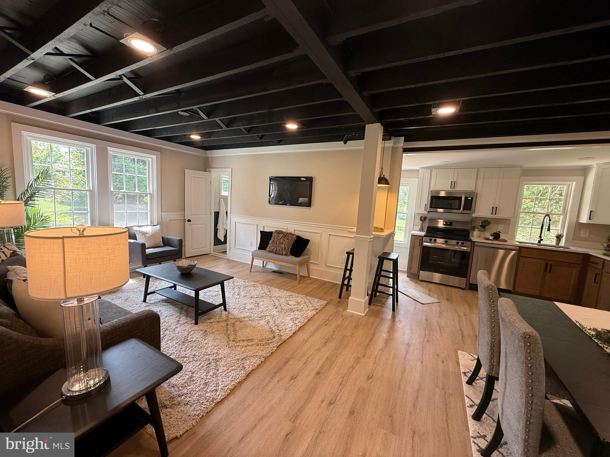 10141 Liberty Road, Unit 1 Randallstown, MD 21133 - Photo 4 of 21 a living room with furniture and a view of kitchen