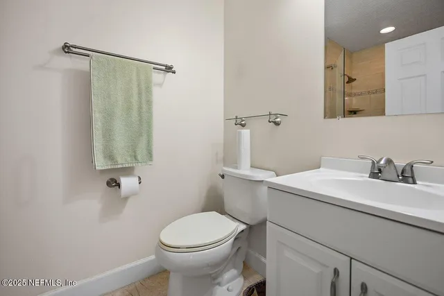 a view of a hallway with wooden floor and stairs