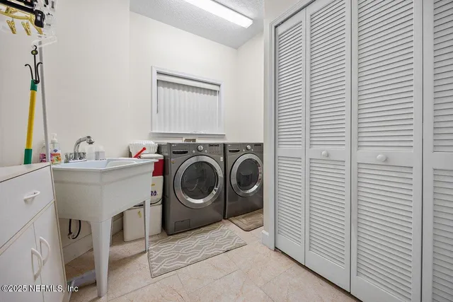 wooden floor with white walls and windows