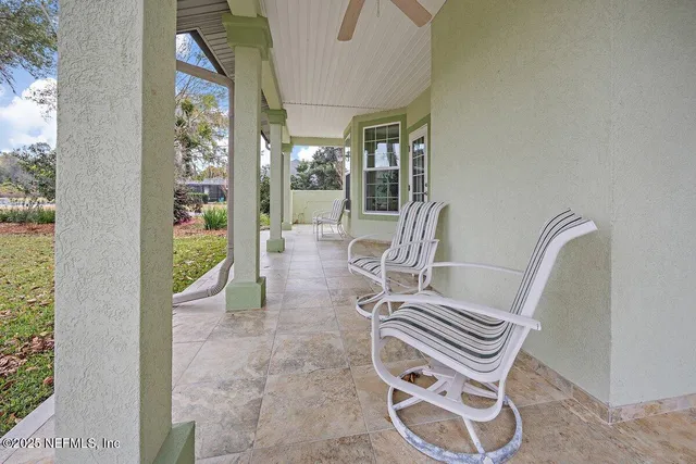 an aerial view of a house with outdoor space