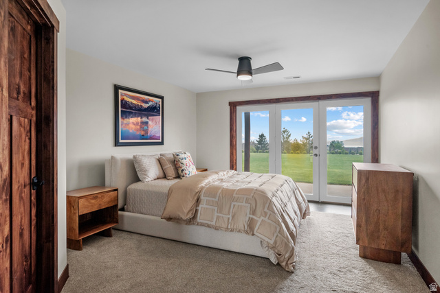 4221 Juniper Circle Alpine, UT 84004 - Photo 31 of 66 Room featuring white French doors, carpeted flooring, a ceiling fan, and wood trim