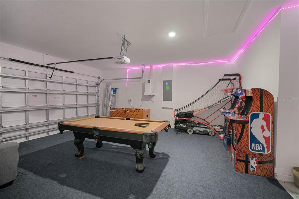 418 Fleming Street Sebastian, FL 32958 - Photo 30 of 38 a room with gym equipment and wooden floor