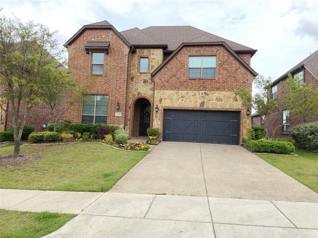a front view of a house with yard