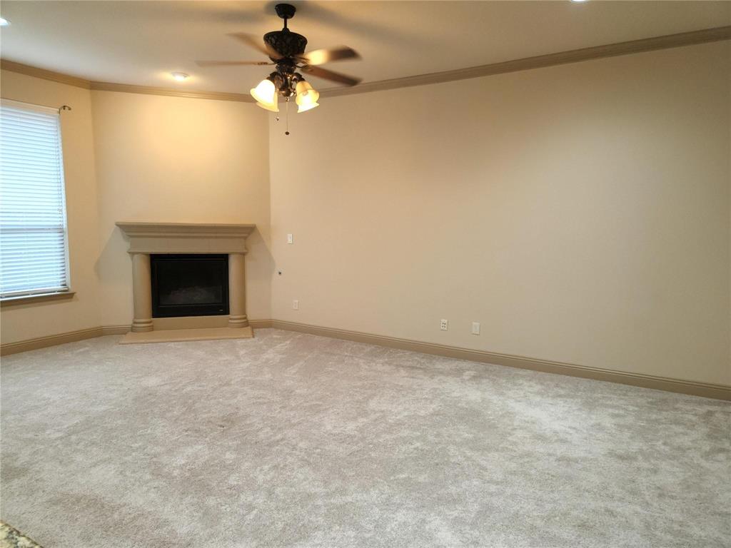 1208 Melcer Street Plano, TX 75074 - Photo 13 of 37 a view of an empty room with a fireplace