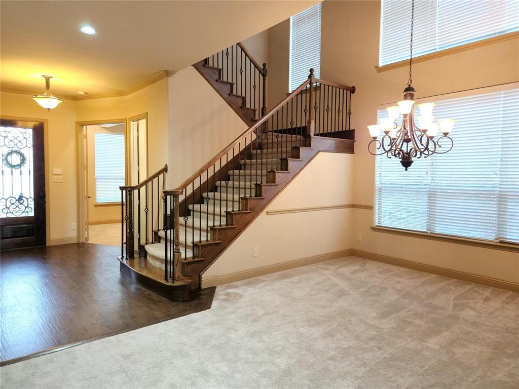 1208 Melcer Street Plano, TX 75074 - Photo 8 of 37 a view of entryway and hall with wooden floor