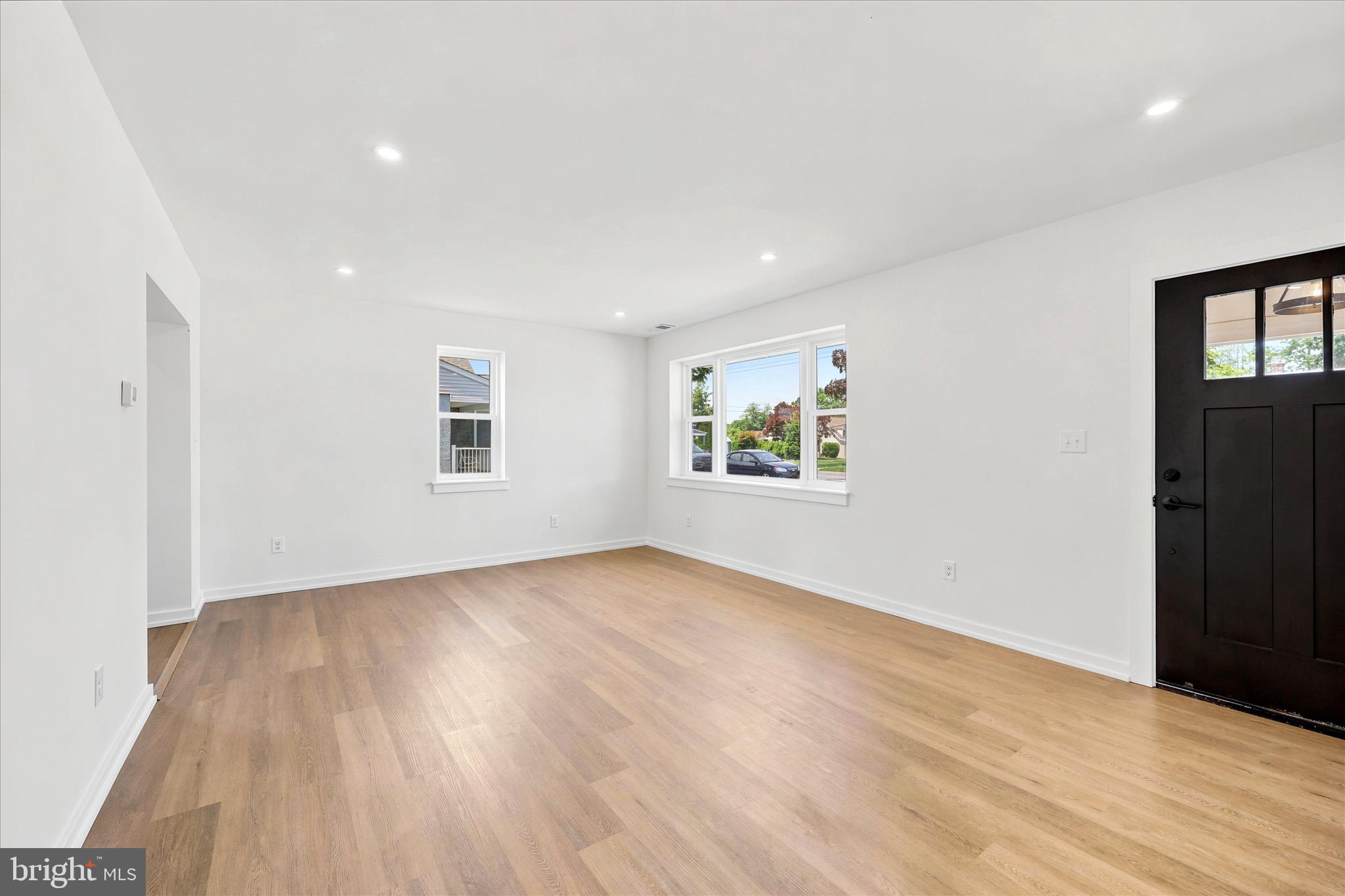 8 James Road Broomall, PA 19008 - Photo 6 of 35 an empty room with wooden floor and windows