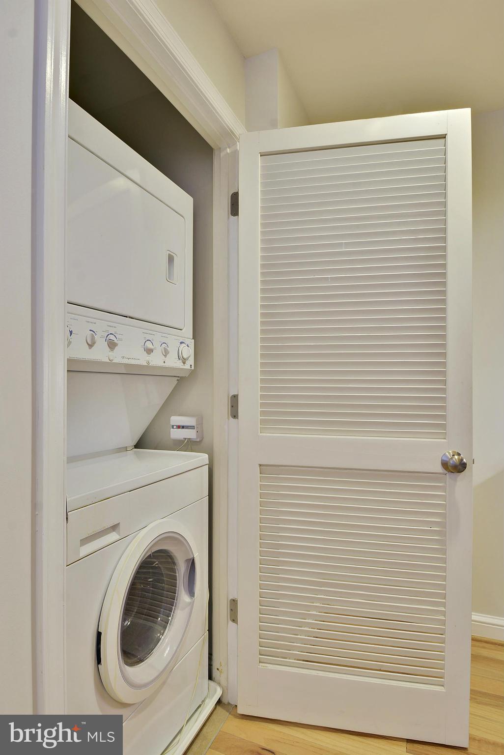 11990 Market Street, Unit 1204 Reston, VA 20190 - Photo 26 of 30 a view of a bathroom with washer and dryer