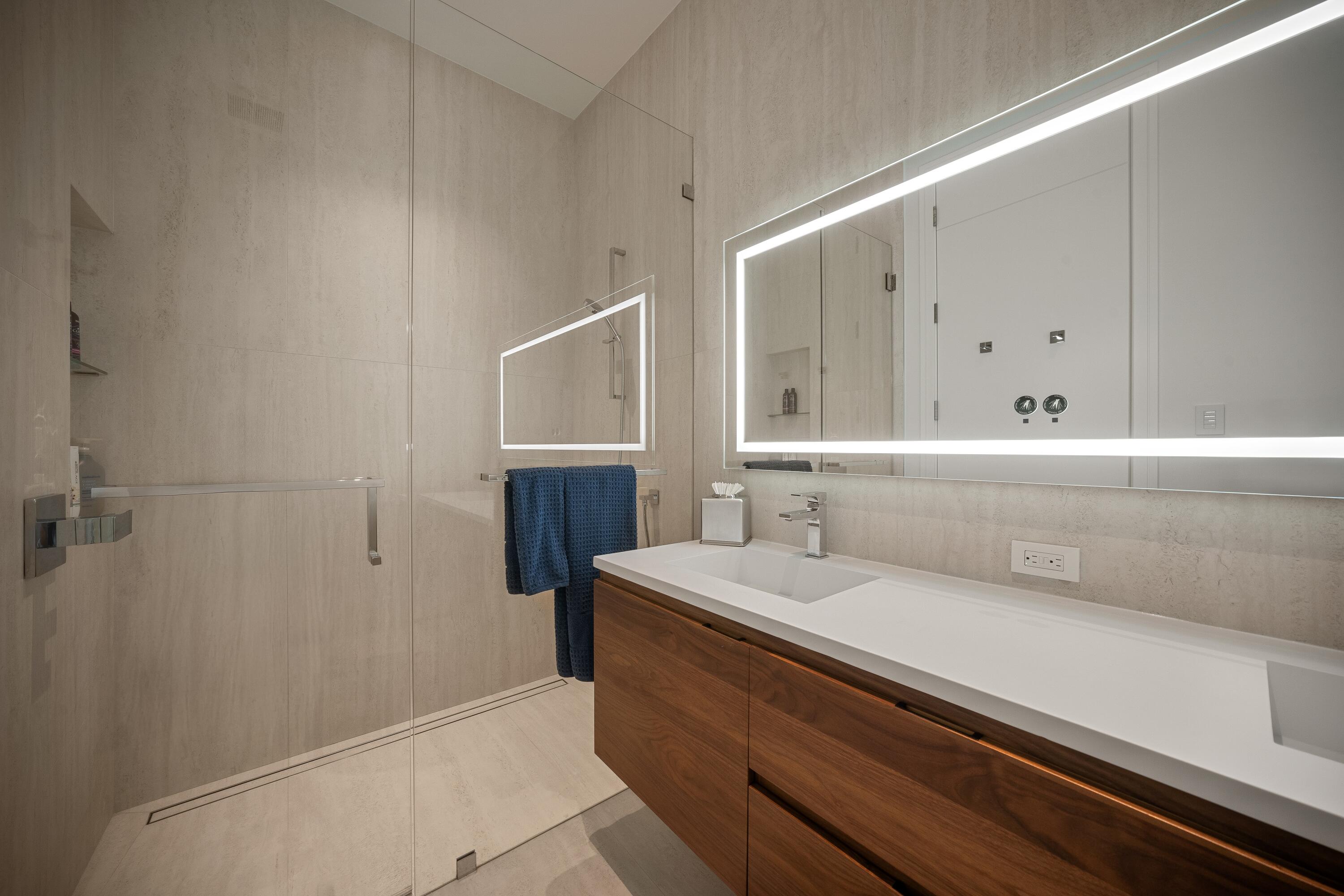 5211 Pennock Point Road Jupiter, FL 33458 - Photo 51 of 69 a bathroom with a sink a vanity and a mirror