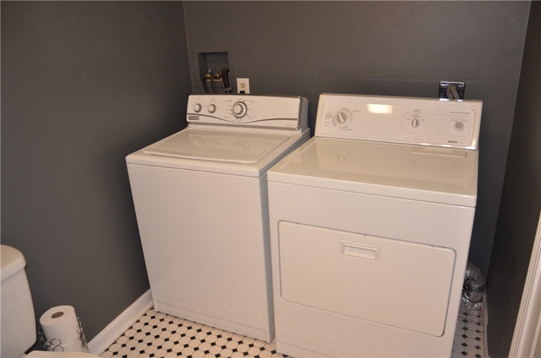 8 Sandy Lane Burrillville, RI 02830 - Photo 11 of 35 The first floor laundry is located within the half bath and the washer & dryer remain!