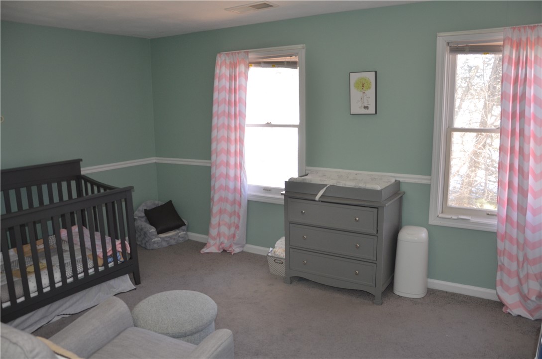 8 Sandy Lane Burrillville, RI 02830 - Photo 26 of 35 The second bedroom gets lots of natural light from these two windows.