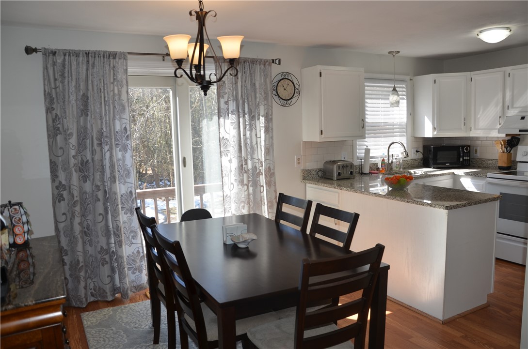 8 Sandy Lane Burrillville, RI 02830 - Photo 7 of 35 Dining area opens to an updated kitchen with easy to clean laminate flooring through out