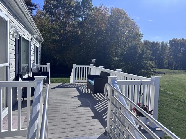 a view of a chairs on wooden deck