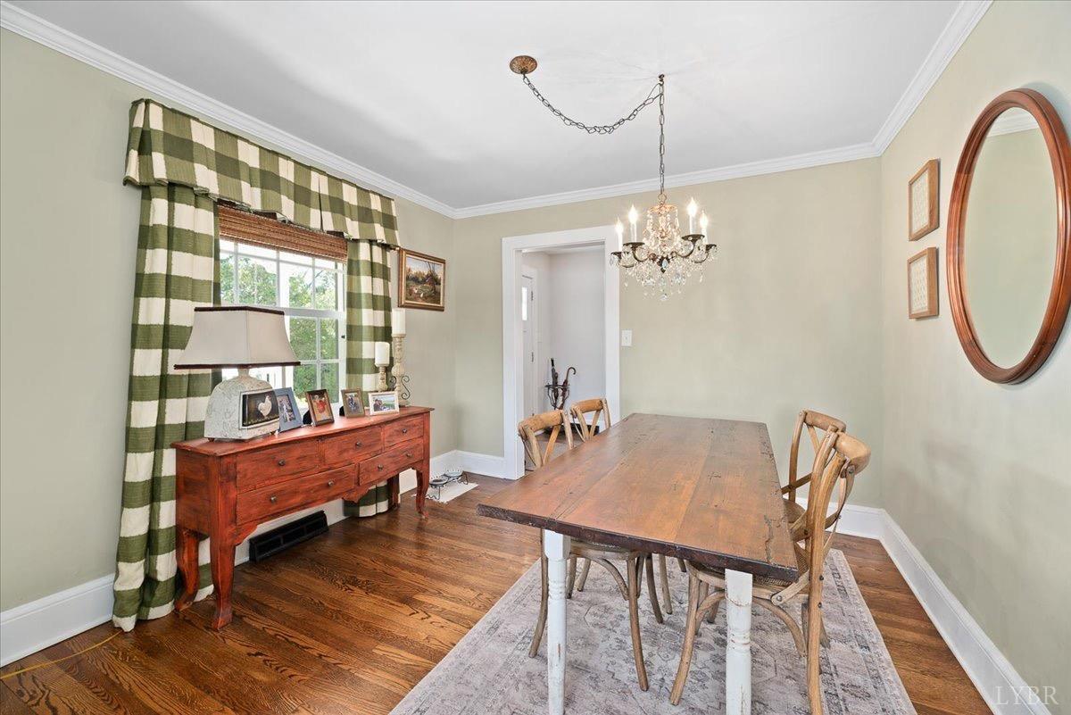 380 St Marys Road Amherst, VA 24521 - Photo 17 of 20 a dining room with furniture a chandelier and wooden floor