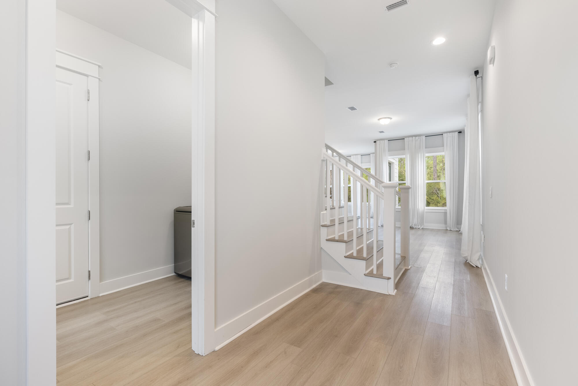 248 Euvino Way Santa Rosa Beach, FL 32459 - Photo 11 of 56 a view of an empty room with wooden floor