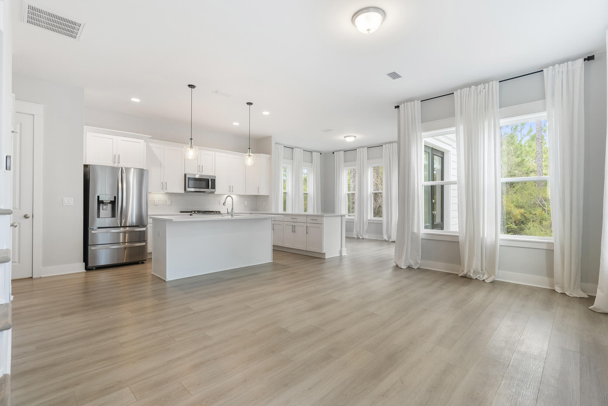 248 Euvino Way Santa Rosa Beach, FL 32459 - Photo 13 of 56 a view of kitchen with wooden floor and electronic appliances