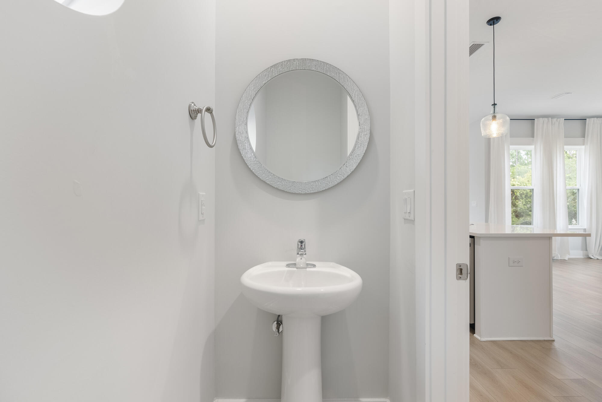 248 Euvino Way Santa Rosa Beach, FL 32459 - Photo 24 of 56 a bathroom with a sink a mirror and a window