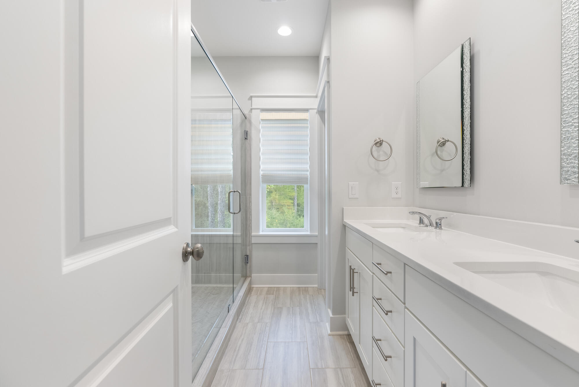 248 Euvino Way Santa Rosa Beach, FL 32459 - Photo 29 of 56 a bathroom with a double vanity sink a mirror and a bathtub