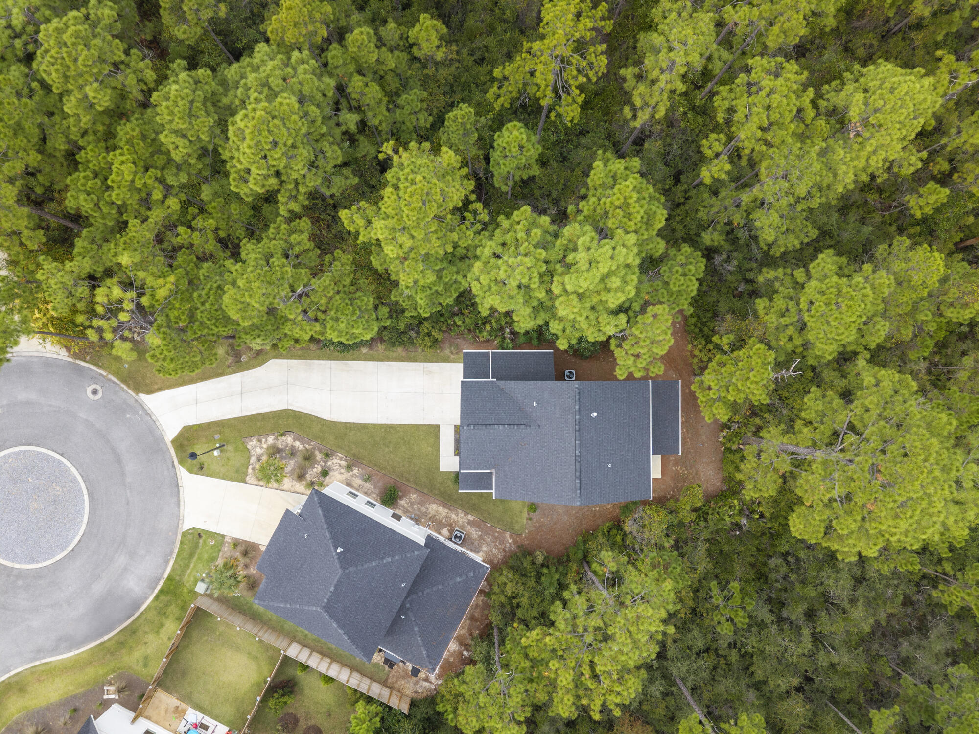 248 Euvino Way Santa Rosa Beach, FL 32459 - Photo 4 of 56 an aerial view of a house with a yard and trees