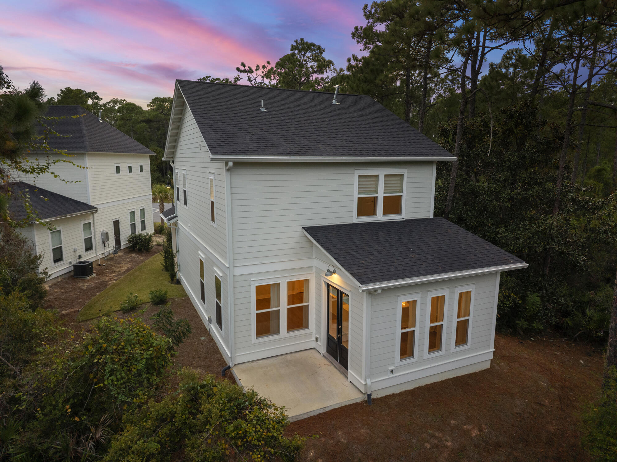 248 Euvino Way Santa Rosa Beach, FL 32459 - Photo 47 of 56 a front view of a house with a yard and garage