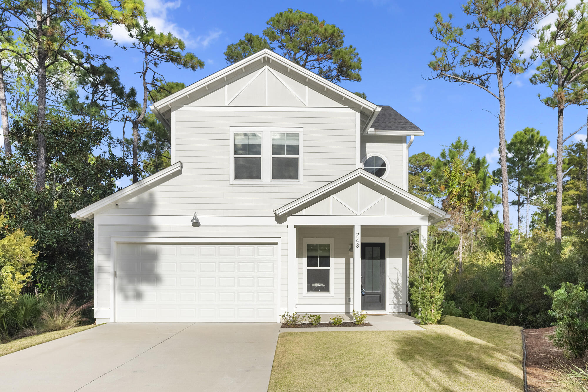248 Euvino Way Santa Rosa Beach, FL 32459 - Photo 7 of 56 a view of a house with a yard and potted plants