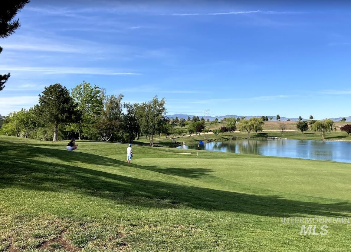 4545 East Hubbard Road Kuna, ID 83634 - Photo 2 of 2 View of home's community with a water and mountain view and golf course view