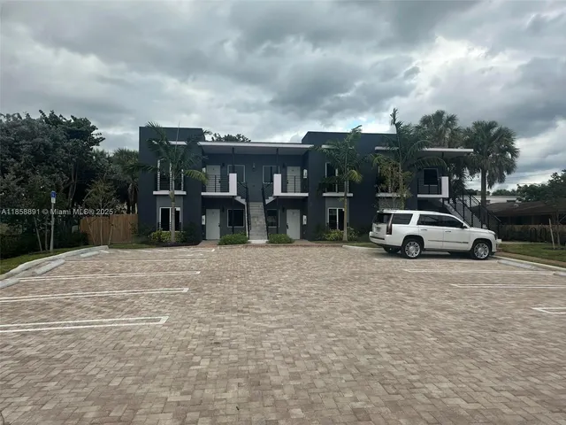 a view of car parked in parking lot at street