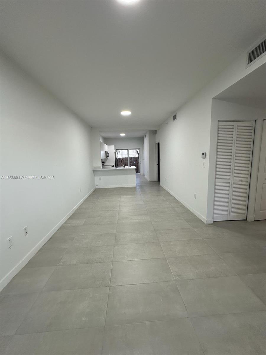 541 Southwest 2nd Court, Unit 5 Pompano Beach, FL 33060 - Photo 11 of 20 a view of an empty room with a window