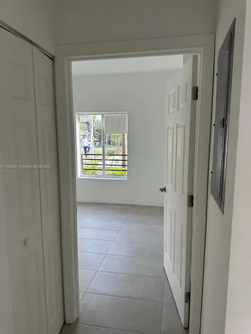 a view of an empty room with a window