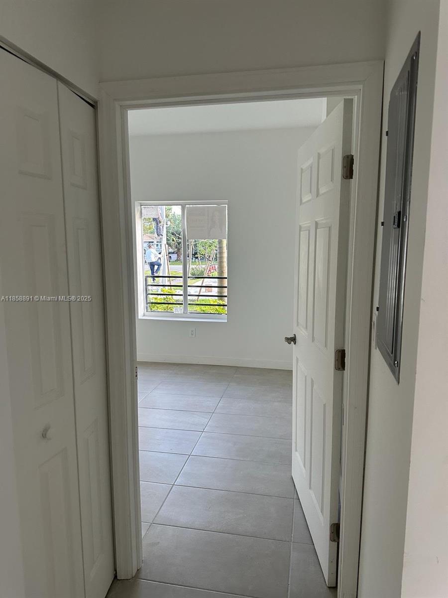 541 Southwest 2nd Court, Unit 5 Pompano Beach, FL 33060 - Photo 4 of 20 a view of an empty room with a window