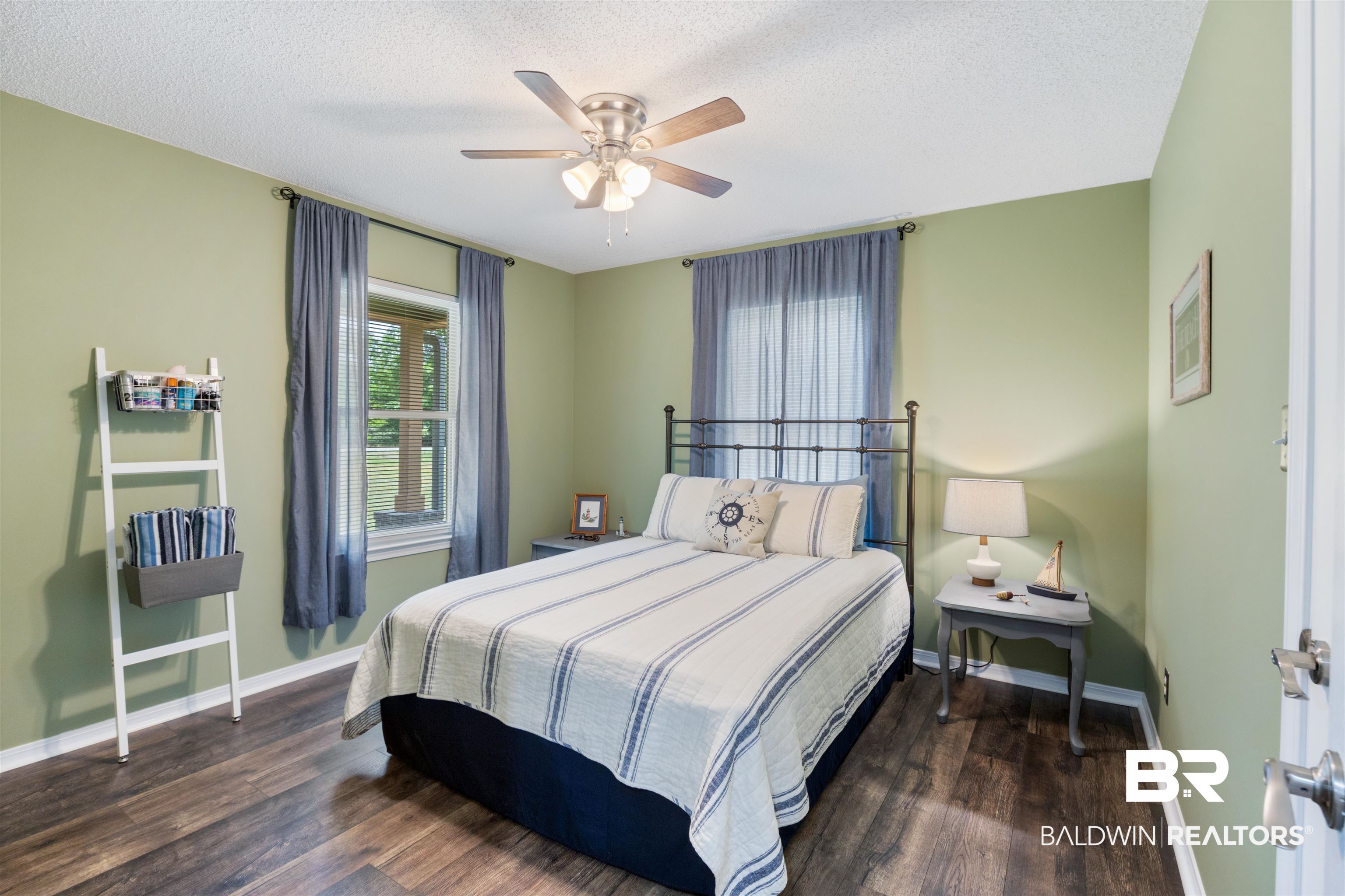 9771 Clarke Ridge Road Foley, AL 36535 - Photo 41 of 72 Bedroom featuring baseboards, a ceiling fan, and textured ceiling.
