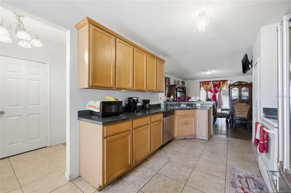 a kitchen with sink cabinets and appliances