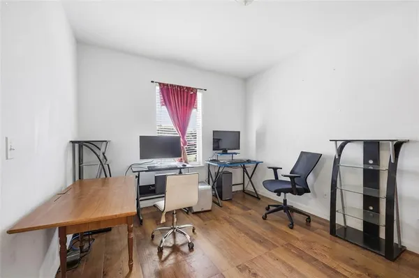 a workspace with furniture and wooden floor
