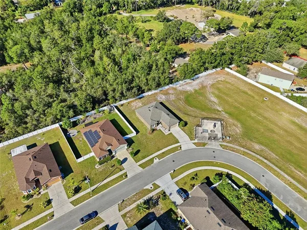 an aerial view of a house with a garden