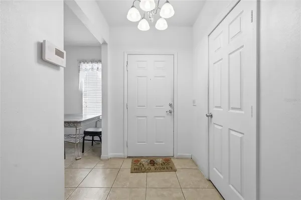 a view of an entryway with kitchen