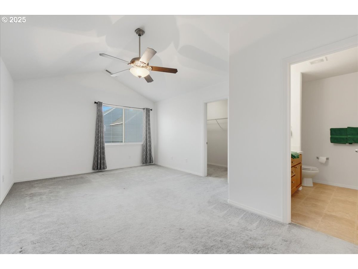 3527 Southeast 197th Avenue Camas, WA 98607 - Photo 17 of 38 a view of an empty room with a ceiling fan