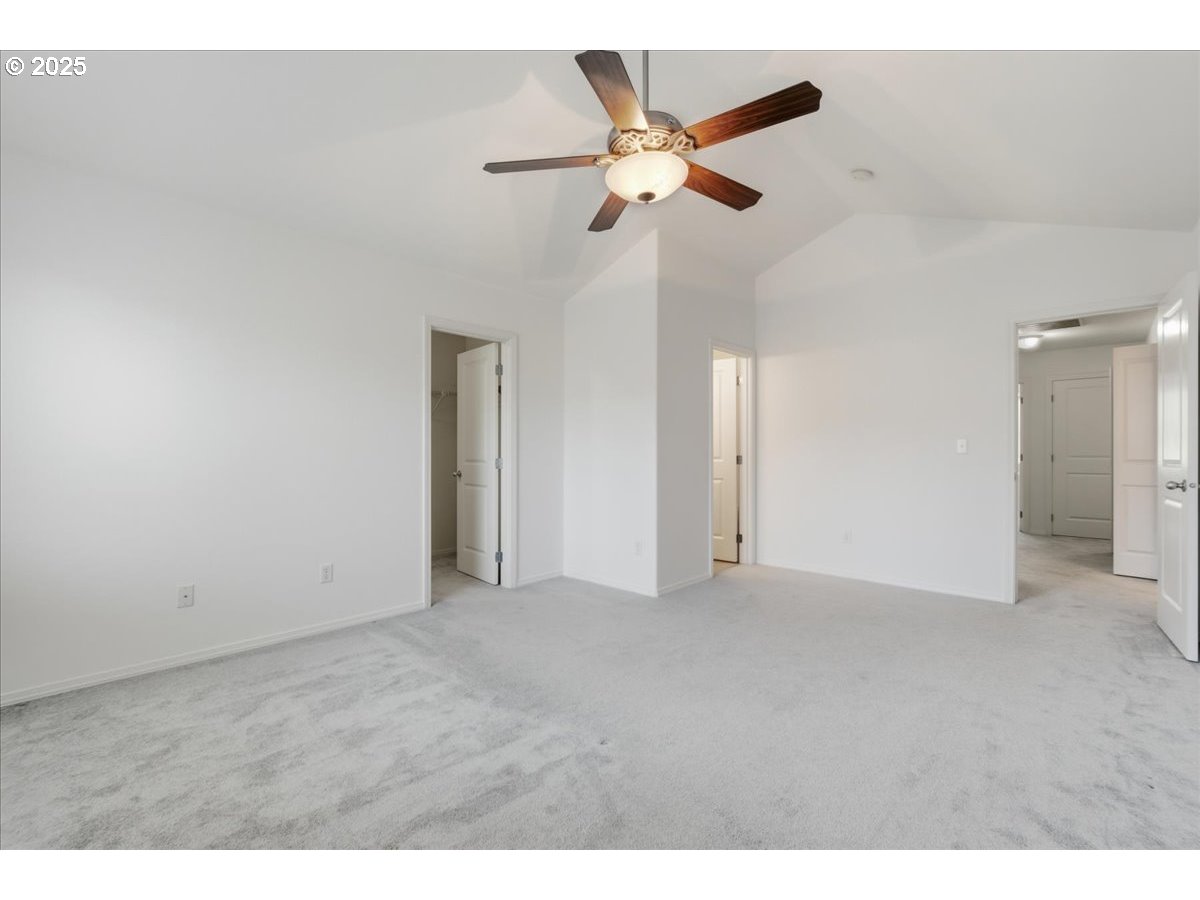 3527 Southeast 197th Avenue Camas, WA 98607 - Photo 18 of 38 a view of an empty room with a ceiling fan