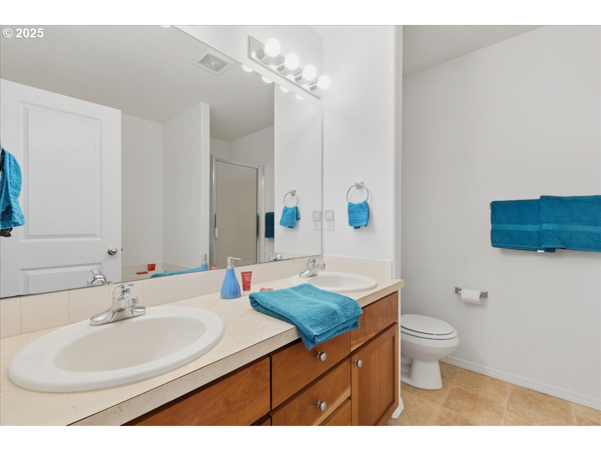 3527 Southeast 197th Avenue Camas, WA 98607 - Photo 20 of 38 a bathroom with a sink a toilet a large mirror and shower