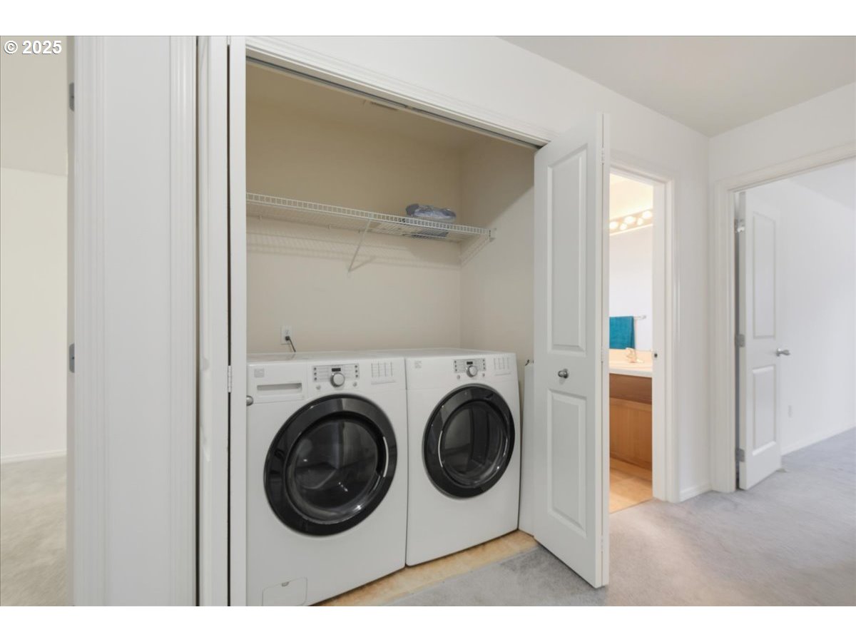 3527 Southeast 197th Avenue Camas, WA 98607 - Photo 27 of 38 a view of a hallway with washer and dryer