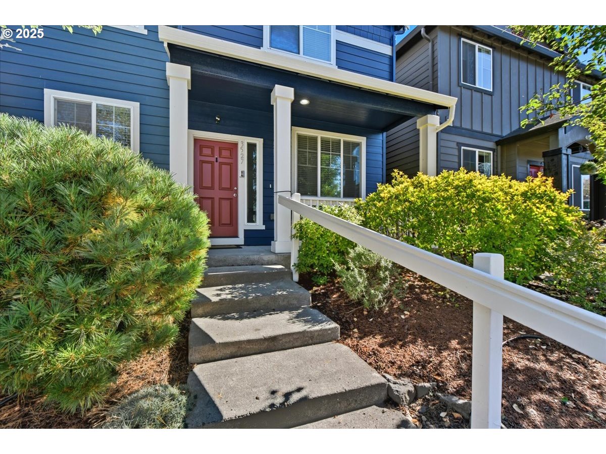 3527 Southeast 197th Avenue Camas, WA 98607 - Photo 4 of 38 a view of a house with brick walls and flower plants