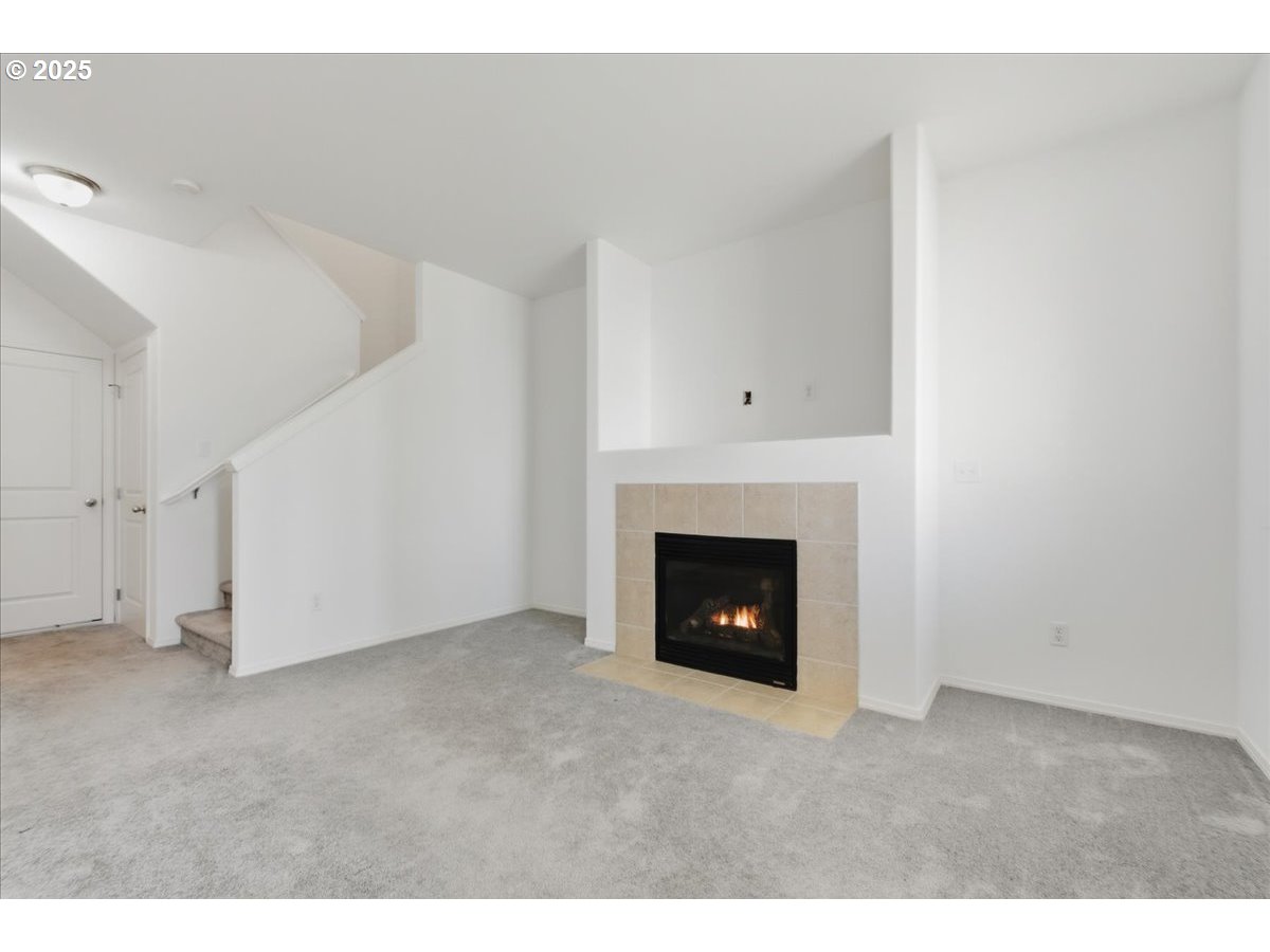 3527 Southeast 197th Avenue Camas, WA 98607 - Photo 9 of 38 a view of an empty room with a fireplace