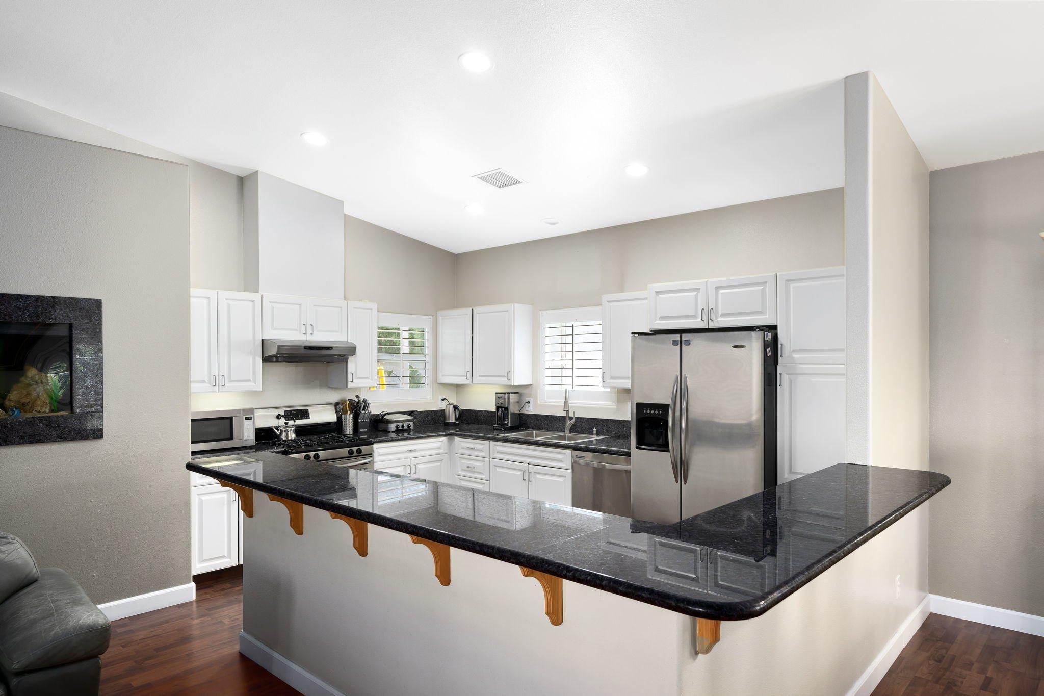 2120 West Nicola Road Palm Springs, CA 92262 - Photo 11 of 37 a kitchen with stainless steel appliances granite countertop a sink a stove and a refrigerator