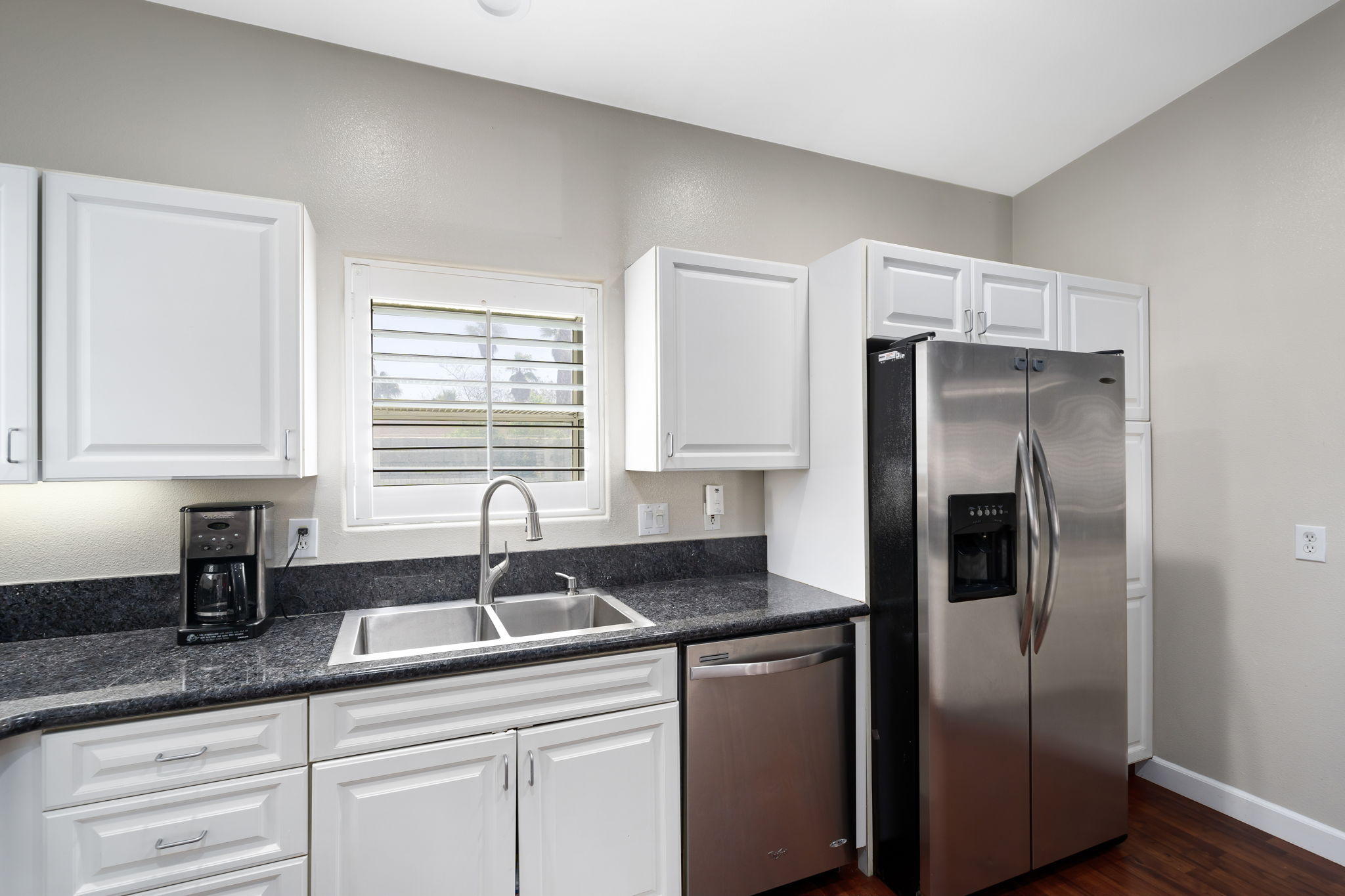 2120 West Nicola Road Palm Springs, CA 92262 - Photo 15 of 37 a kitchen with stainless steel appliances granite countertop a refrigerator and a sink