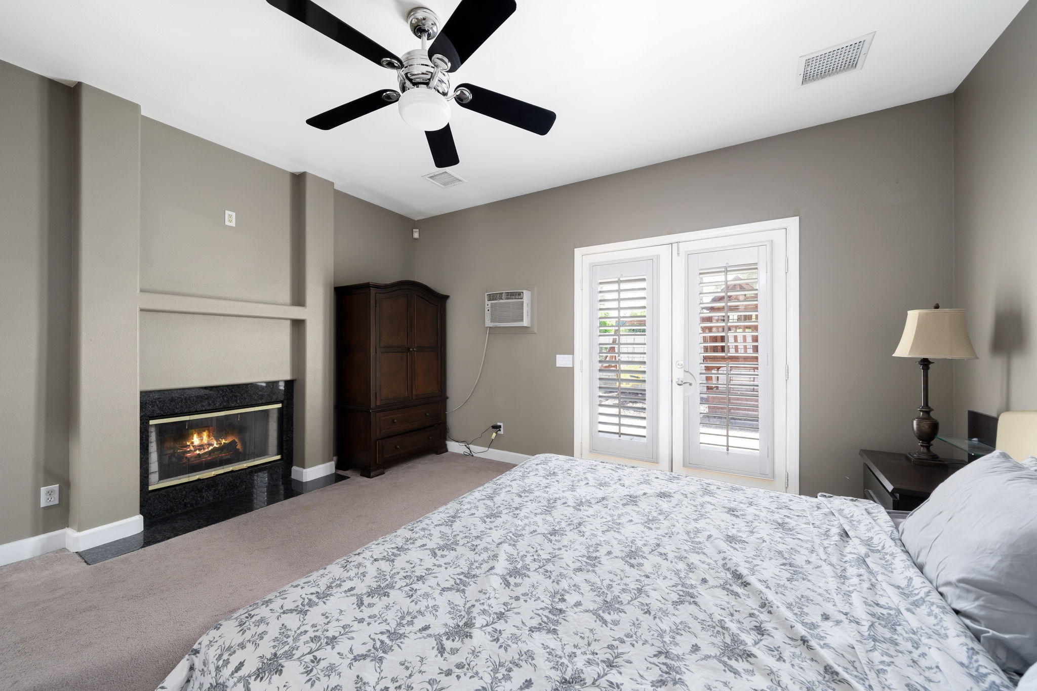 2120 West Nicola Road Palm Springs, CA 92262 - Photo 30 of 37 a bedroom with a bed and a fireplace